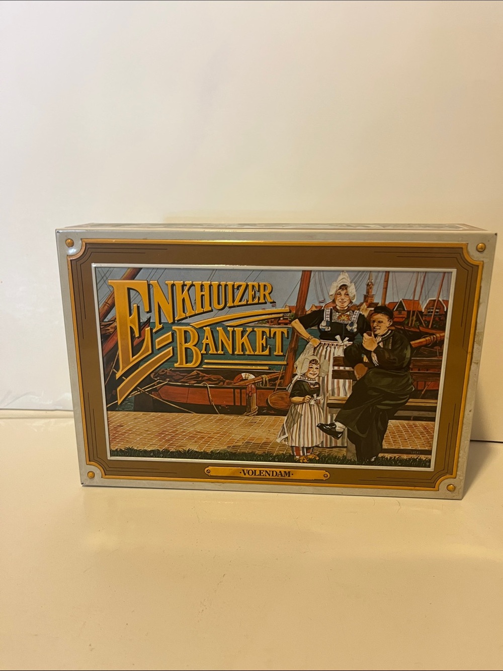 This is a vintage Enkhuizer Banket cookie tin from the Netherlands, specifically
